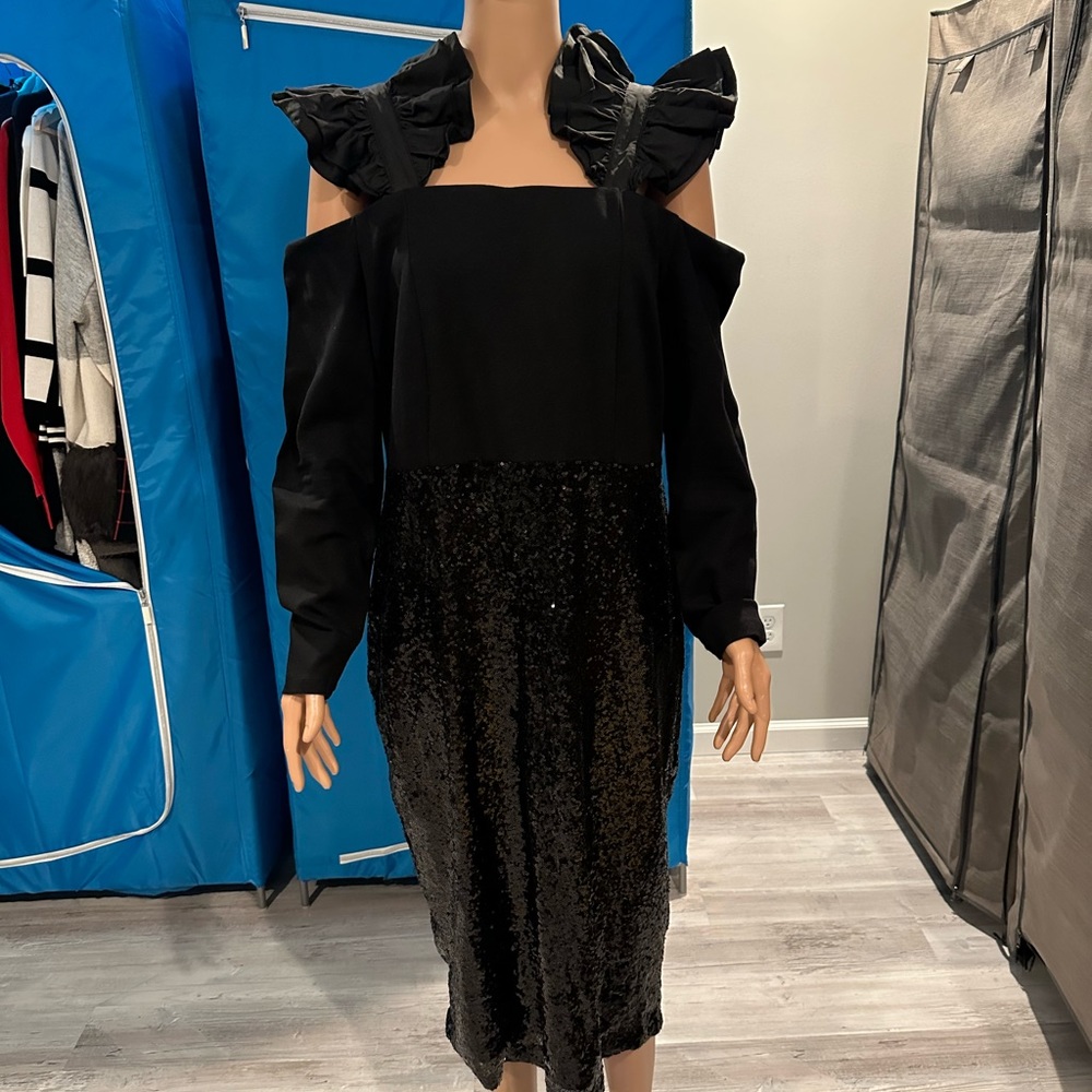 Black cocktail dress with sequenced bottom.